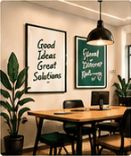 Office meeting area with framed motivational posters and plants